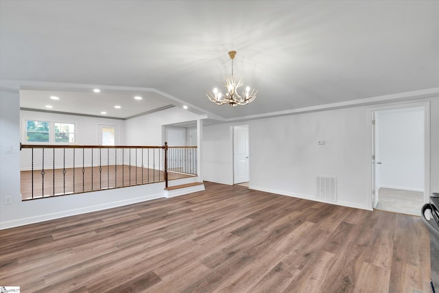 402 Laurel And Hardy Lake Rd, Marietta, SC 29661 - unfurnished living room featuring wood finished floors, a chandelier, recessed lighting, vaulted ceiling, and baseboards