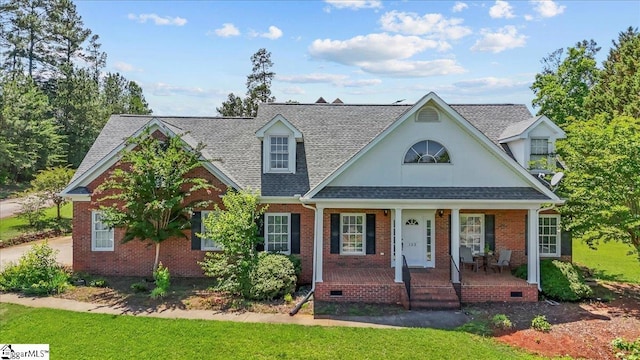 123 S Lake Emory Dr, Inman, SC 29349 - view of front facade featuring a porch, a shingled roof, brick siding, and a front yard