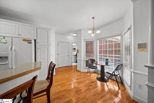 123 S Lake Emory Dr, Inman, SC 29349 - dining area featuring a chandelier, crown molding, light wood-style floors, and baseboards