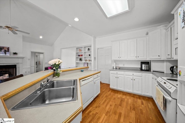 123 S Lake Emory Dr, Inman, SC 29349 - kitchen featuring white appliances, a sink, light wood-style flooring, white cabinets, and vaulted ceiling