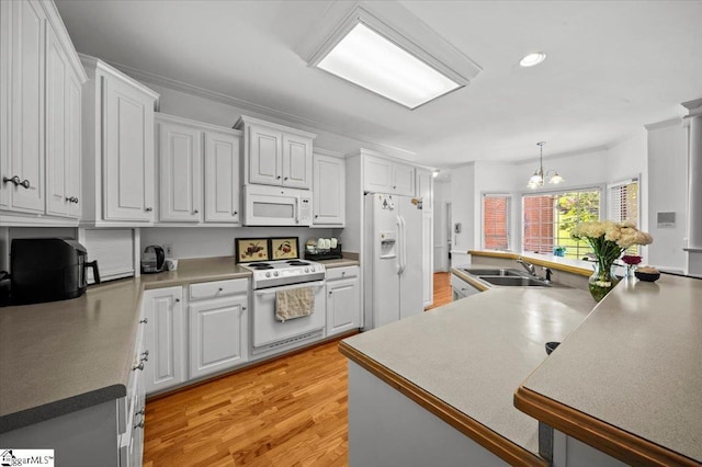 123 S Lake Emory Dr, Inman, SC 29349 - kitchen with white appliances, a chandelier, a sink, light wood-style flooring, and white cabinetry