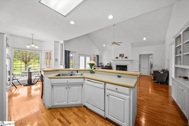 123 S Lake Emory Dr, Inman, SC 29349 - kitchen featuring white appliances, a sink, a fireplace, ceiling fan, and open floor plan