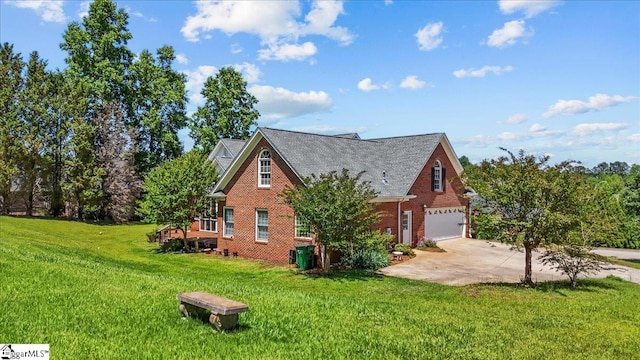123 S Lake Emory Dr, Inman, SC 29349 - view of side of home featuring driveway, brick siding, an attached garage, and a lawn