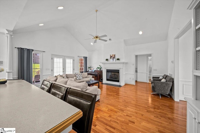 123 S Lake Emory Dr, Inman, SC 29349 - living area with high vaulted ceiling, light wood-style flooring, a ceiling fan, a fireplace with flush hearth, and recessed lighting