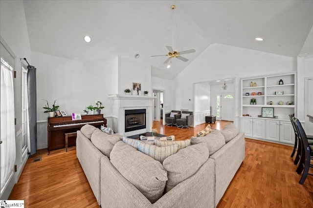 123 S Lake Emory Dr, Inman, SC 29349 - living room featuring a ceiling fan, high vaulted ceiling, light wood-type flooring, a fireplace, and recessed lighting