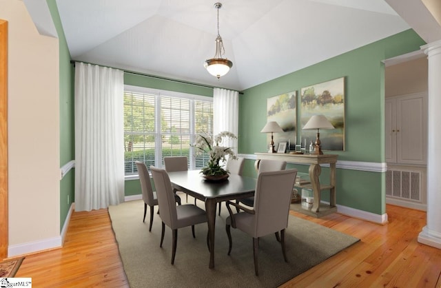 404 N Tidewater Trl, Inman, SC 29349 - dining area with decorative columns, light wood finished floors, baseboards, and lofted ceiling