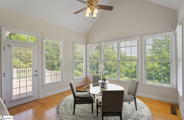 404 N Tidewater Trl, Inman, SC 29349 - sunroom with high vaulted ceiling, baseboards, wood finished floors, french doors, and a wooden deck