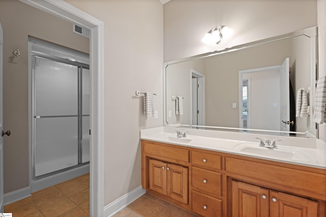 404 N Tidewater Trl, Inman, SC 29349 - full bath with double vanity, a shower stall, baseboards, and tile patterned floors
