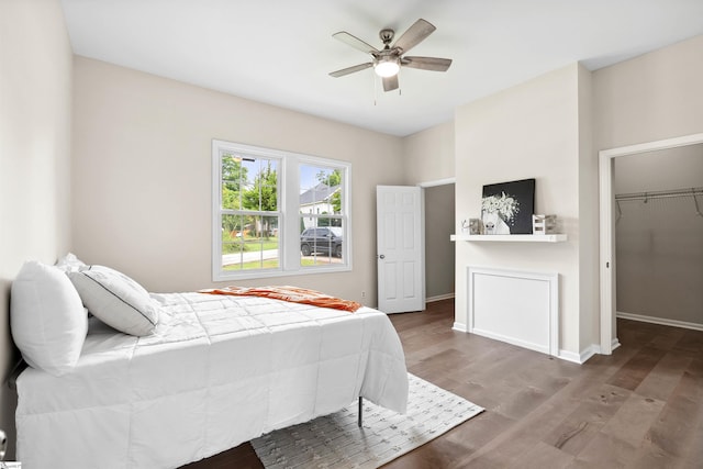 1316 E S 6th St, Seneca, SC 29678 - bedroom with wood finished floors, a spacious closet, ceiling fan, and baseboards