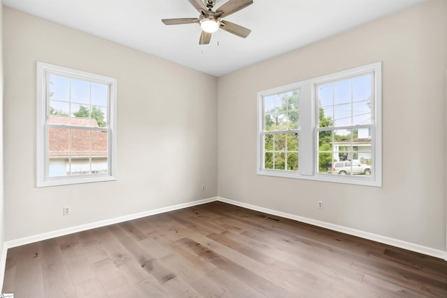 1316 E S 6th St, Seneca, SC 29678 - unfurnished room with healthy amount of natural light, baseboards, and wood finished floors