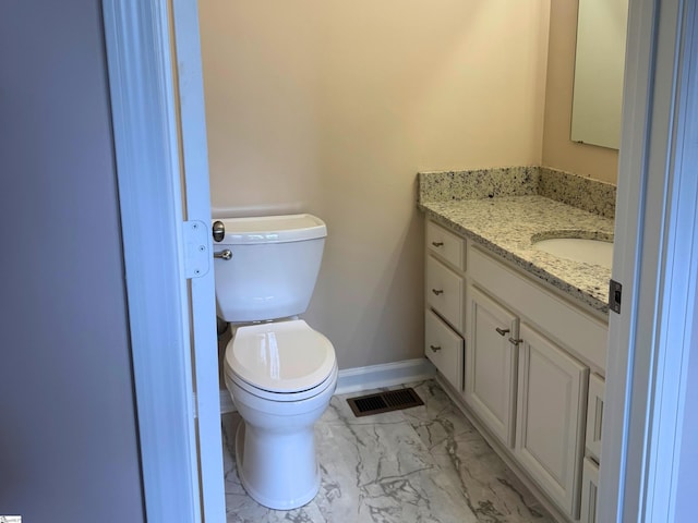 1316 E S 6th St, Seneca, SC 29678 - bathroom with marble finish flooring, vanity, toilet, and baseboards