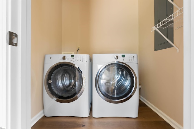 1316 E S 6th St, Seneca, SC 29678 - laundry room featuring washing machine and clothes dryer, wood finished floors, and baseboards