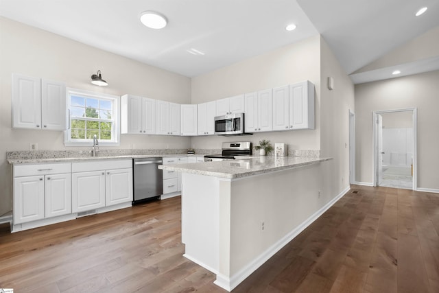 1316 E S 6th St, Seneca, SC 29678 - kitchen featuring stainless steel appliances, light wood-style flooring, white cabinets, light stone counters, and recessed lighting