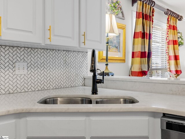 312 Terrace Hills Dr, Boiling Springs, SC 29316 - kitchen with a sink, light countertops, white cabinetry, tasteful backsplash, and stainless steel dishwasher