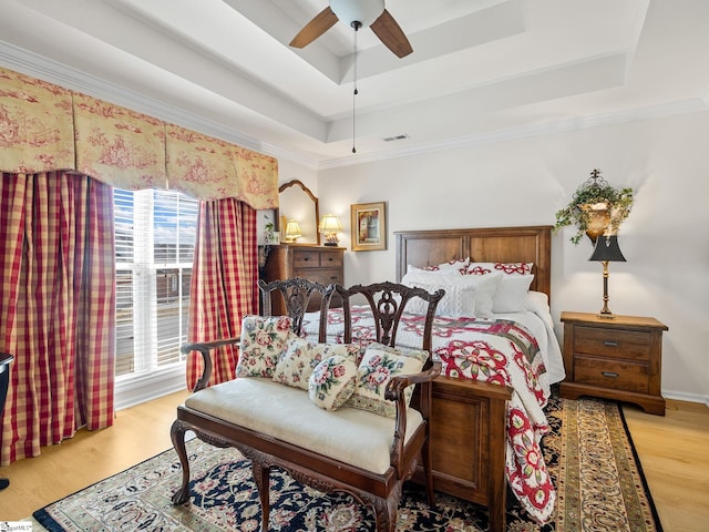 312 Terrace Hills Dr, Boiling Springs, SC 29316 - bedroom featuring a tray ceiling, wood finished floors, ornamental molding, and a ceiling fan