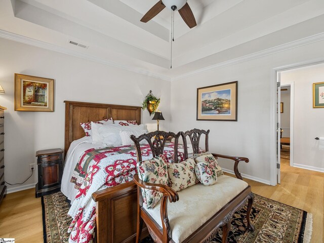 312 Terrace Hills Dr, Boiling Springs, SC 29316 - bedroom with light wood-style floors, a raised ceiling, a ceiling fan, baseboards, and ornamental molding