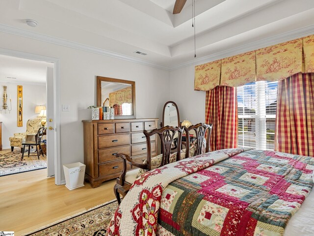 312 Terrace Hills Dr, Boiling Springs, SC 29316 - bedroom featuring light wood-type flooring, ornamental molding, a tray ceiling, and ceiling fan
