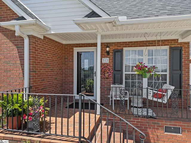 312 Terrace Hills Dr, Boiling Springs, SC 29316 - property entrance featuring brick siding and a shingled roof
