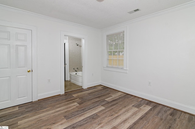 208 Arlington Avenue Unit A And B, Anderson, SC 29621 - unfurnished bedroom with wood finished floors, crown molding, baseboards, a textured ceiling, and connected bathroom