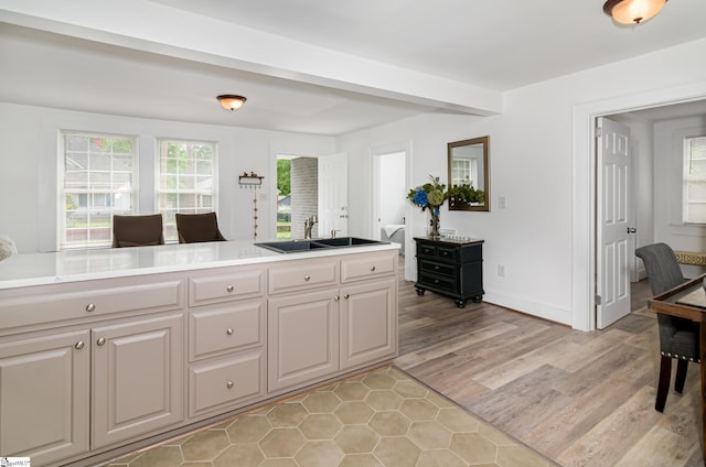 208 Arlington Avenue Unit A And B, Anderson, SC 29621 - kitchen with a sink, light wood finished floors, baseboards, and light countertops