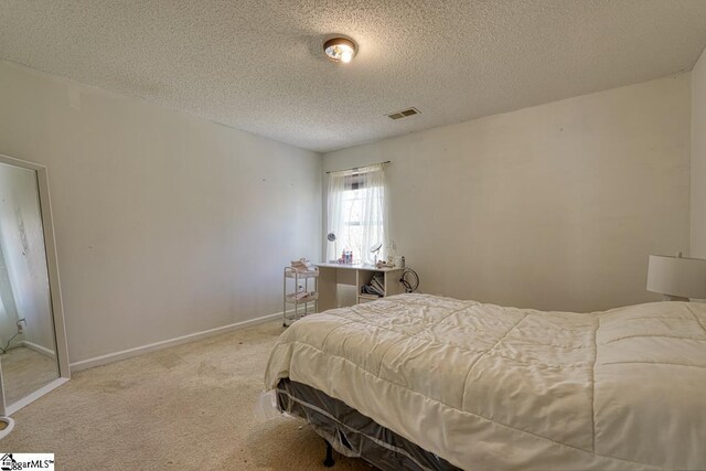 406 Standing Rock Dr, Boiling Springs, SC 29316 - bedroom featuring a textured ceiling, carpet floors, and baseboards
