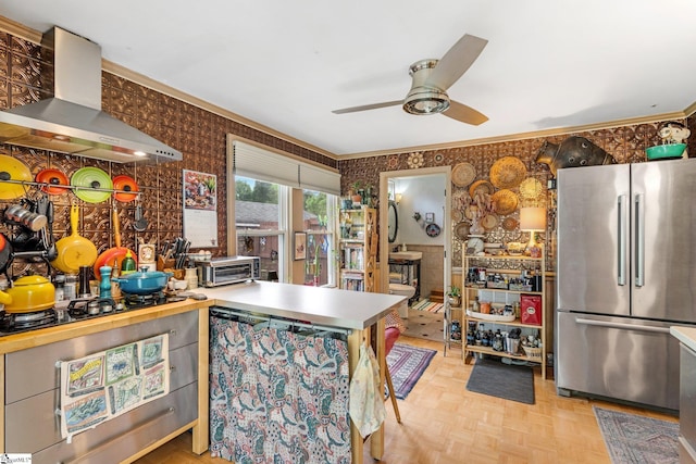 298 Stamey Valley Rd, Travelers Rest, SC 29690 - kitchen with freestanding refrigerator, wall chimney exhaust hood, ceiling fan, wallpapered walls, and black gas stovetop