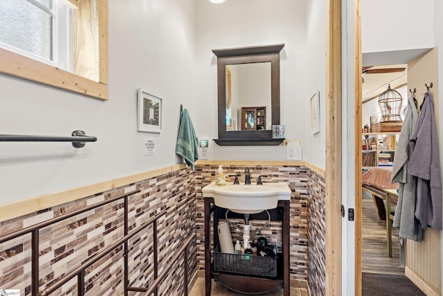 298 Stamey Valley Rd, Travelers Rest, SC 29690 - bathroom featuring a wainscoted wall, tile walls, and a sink