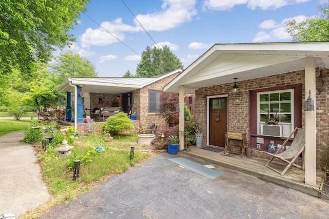 298 Stamey Valley Rd, Travelers Rest, SC 29690 - view of front facade with a porch, brick siding, and cooling unit
