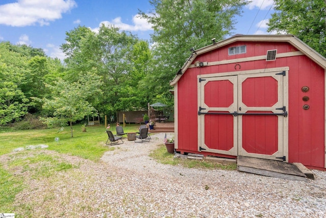 298 Stamey Valley Rd, Travelers Rest, SC 29690 - view of shed with an outdoor fire pit