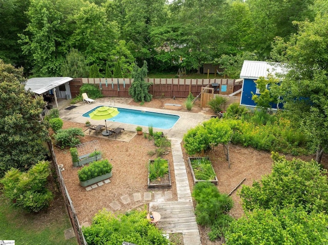 298 Stamey Valley Rd, Travelers Rest, SC 29690 - view of pool with a garden, a fenced backyard, and an outbuilding