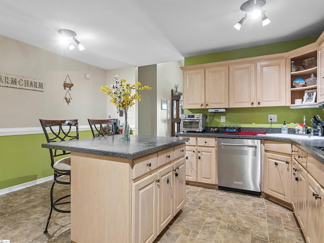 112 Scruggs Ln, Gaffney, SC 29341 - kitchen featuring dishwasher, light brown cabinetry, a breakfast bar, stone finish floors, and dark countertops