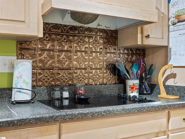 112 Scruggs Ln, Gaffney, SC 29341 - kitchen with under cabinet range hood, black electric cooktop, decorative backsplash, and dark countertops