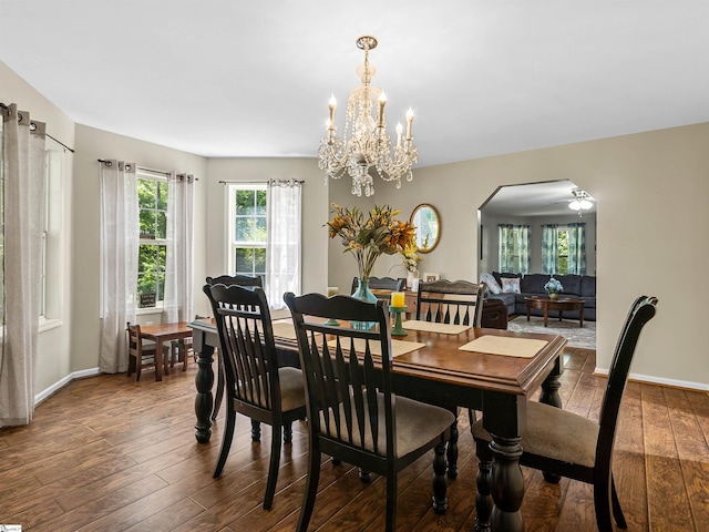 112 Scruggs Ln, Gaffney, SC 29341 - dining space with hardwood / wood-style flooring, arched walkways, a chandelier, and baseboards