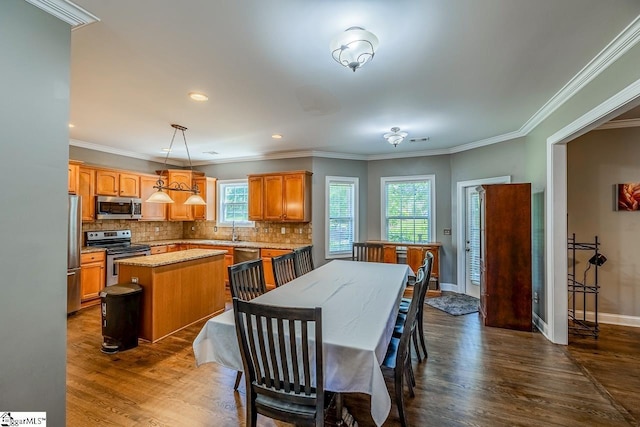 414 Mayburgh Ct, Spartanburg, SC 29301 - dining area featuring healthy amount of natural light, dark wood finished floors, baseboards, crown molding, and recessed lighting