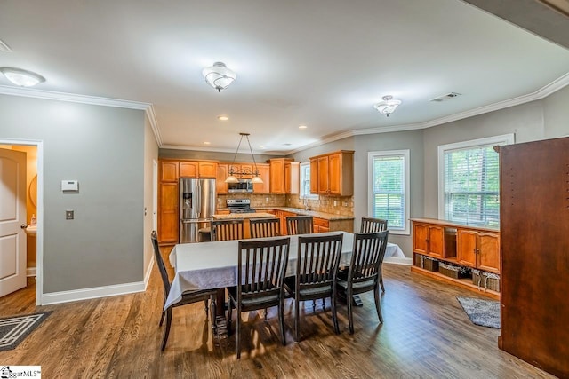 414 Mayburgh Ct, Spartanburg, SC 29301 - dining room featuring dark wood finished floors, baseboards, ornamental molding, and recessed lighting