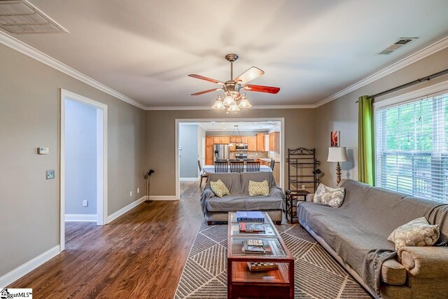414 Mayburgh Ct, Spartanburg, SC 29301 - living area featuring a ceiling fan, dark wood-type flooring, baseboards, and crown molding