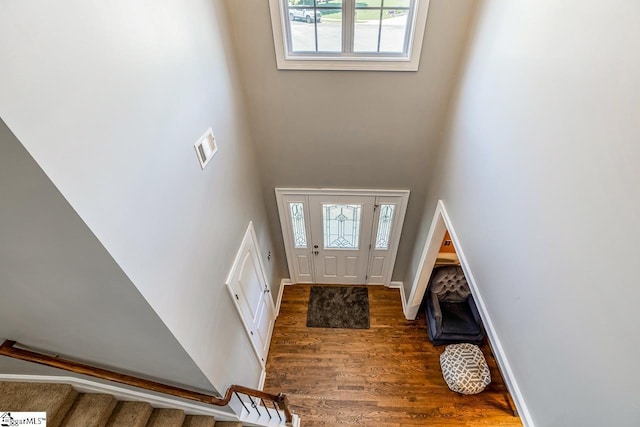 414 Mayburgh Ct, Spartanburg, SC 29301 - foyer with plenty of natural light, wood finished floors, a towering ceiling, stairs, and baseboards