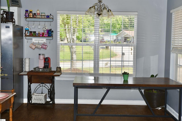 505 W Miter Saw Ct, Greer, SC 29651 - dining room featuring a chandelier, plenty of natural light, baseboards, and wood finished floors