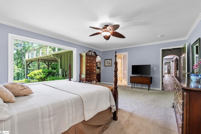 212 Middleton Shores Dr, Anderson, SC 29621 - carpeted bedroom with arched walkways, crown molding, ceiling fan, and baseboards