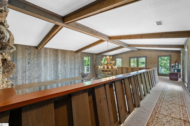 212 Middleton Shores Dr, Anderson, SC 29621 - hall with a chandelier, carpet floors, and wood walls