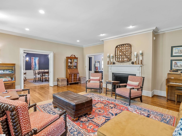 1076 Woodburn Rd, Spartanburg, SC 29302 - living area with wood finished floors, crown molding, recessed lighting, a fireplace, and baseboards