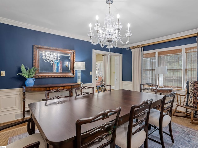 1076 Woodburn Rd, Spartanburg, SC 29302 - dining space with a chandelier, a wainscoted wall, and crown molding