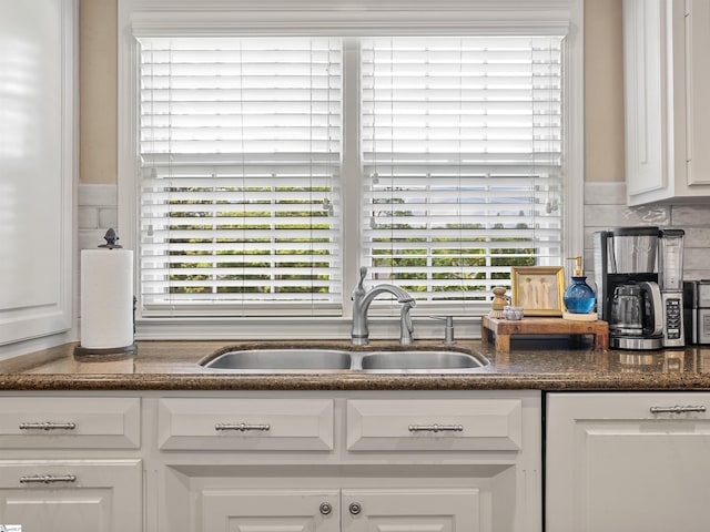 1076 Woodburn Rd, Spartanburg, SC 29302 - kitchen featuring a sink, white cabinets, and plenty of natural light