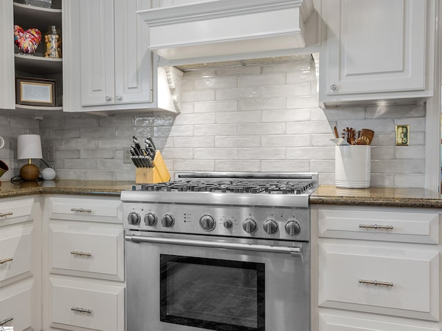 1076 Woodburn Rd, Spartanburg, SC 29302 - kitchen featuring high end stainless steel range, tasteful backsplash, white cabinetry, and premium range hood