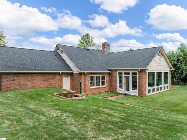 1076 Woodburn Rd, Spartanburg, SC 29302 - back of house with brick siding, a shingled roof, a chimney, a yard, and a sunroom