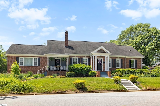 201 W Arlington Ave, Greer, SC 29650 - view of front of house featuring brick siding, a chimney, and a front yard