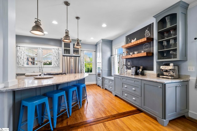 201 W Arlington Ave, Greer, SC 29650 - kitchen with stainless steel appliances, gray cabinets, light wood-style floors, open shelves, and recessed lighting