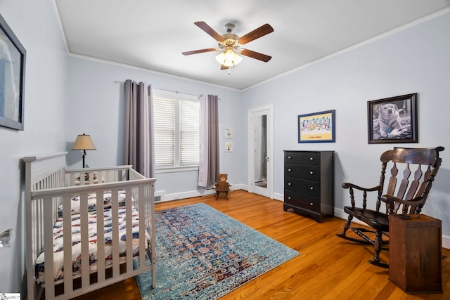 201 W Arlington Ave, Greer, SC 29650 - bedroom featuring crown molding, wood finished floors, baseboards, and a ceiling fan