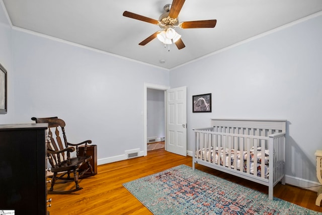 201 W Arlington Ave, Greer, SC 29650 - bedroom featuring crown molding, wood finished floors, baseboards, and ceiling fan