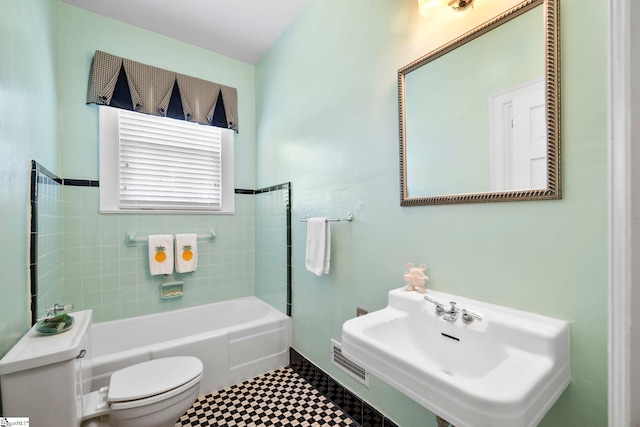 201 W Arlington Ave, Greer, SC 29650 - bathroom featuring toilet, a bath, and a sink
